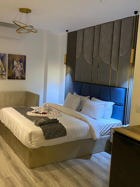 Postel nebo postele na pokoji v ubytování Elite Pyramids Boutique Hotel