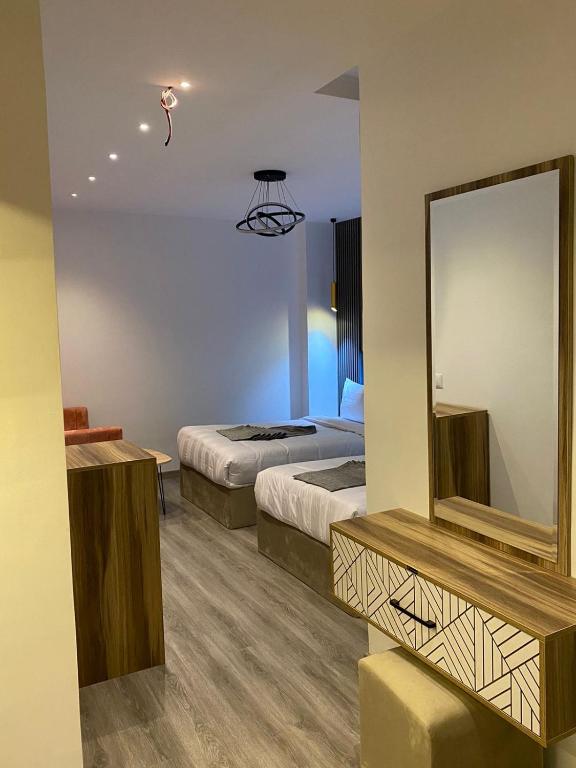 Postel nebo postele na pokoji v ubytování Elite Pyramids Boutique Hotel
