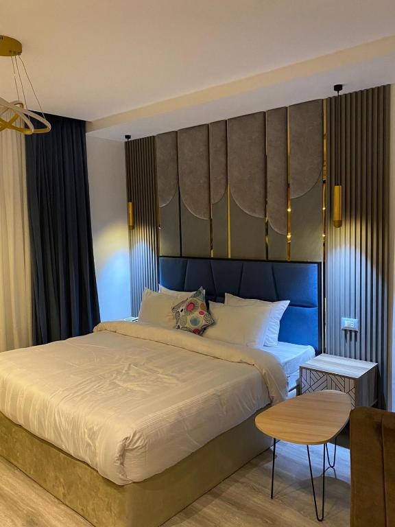 Postel nebo postele na pokoji v ubytování Elite Pyramids Boutique Hotel