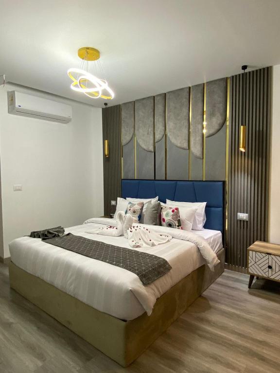 Postel nebo postele na pokoji v ubytování Elite Pyramids Boutique Hotel