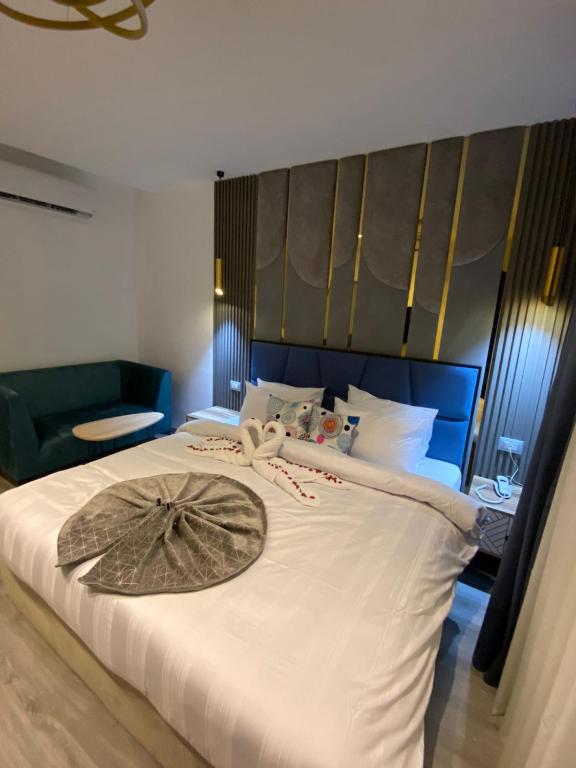 Postel nebo postele na pokoji v ubytování Elite Pyramids Boutique Hotel
