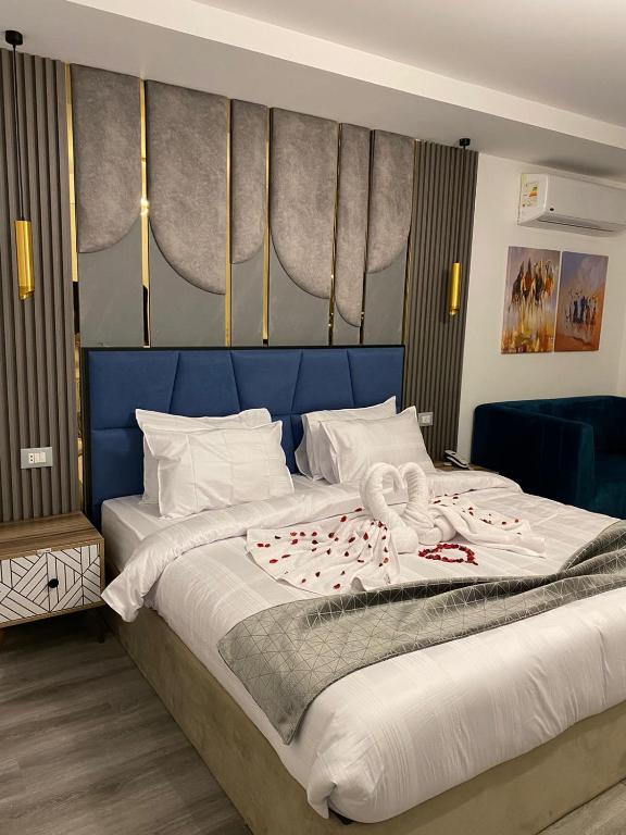 Postel nebo postele na pokoji v ubytování Elite Pyramids Boutique Hotel