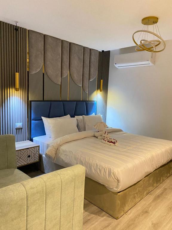 Postel nebo postele na pokoji v ubytování Elite Pyramids Boutique Hotel