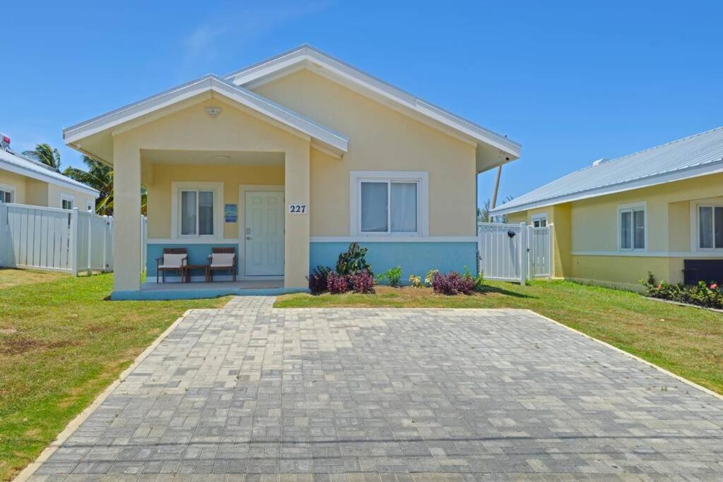 a house with a driveway in front of it at SeaJam Vacation Home between Negril & Montego Bay in Point