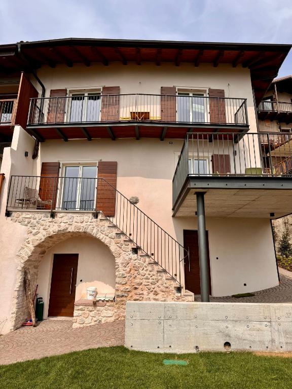 a large building with balconies on the side of it at Eco Garda Hill in Tenno