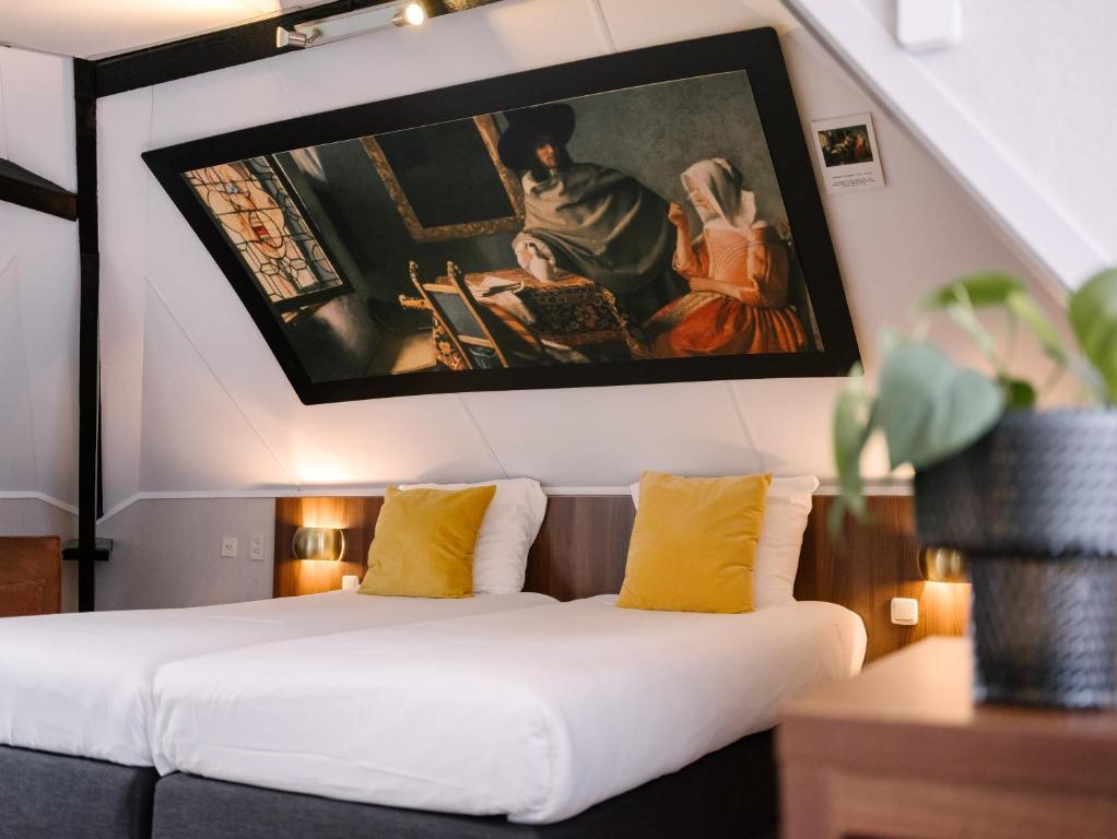 Postel nebo postele na pokoji v ubytování Hotel de Koophandel