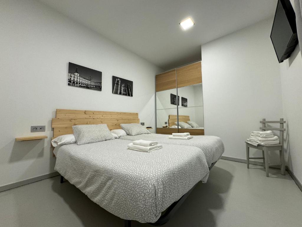 Posteľ alebo postele v izbe v ubytovaní Apartamentos Mk77 León- San Isidoro