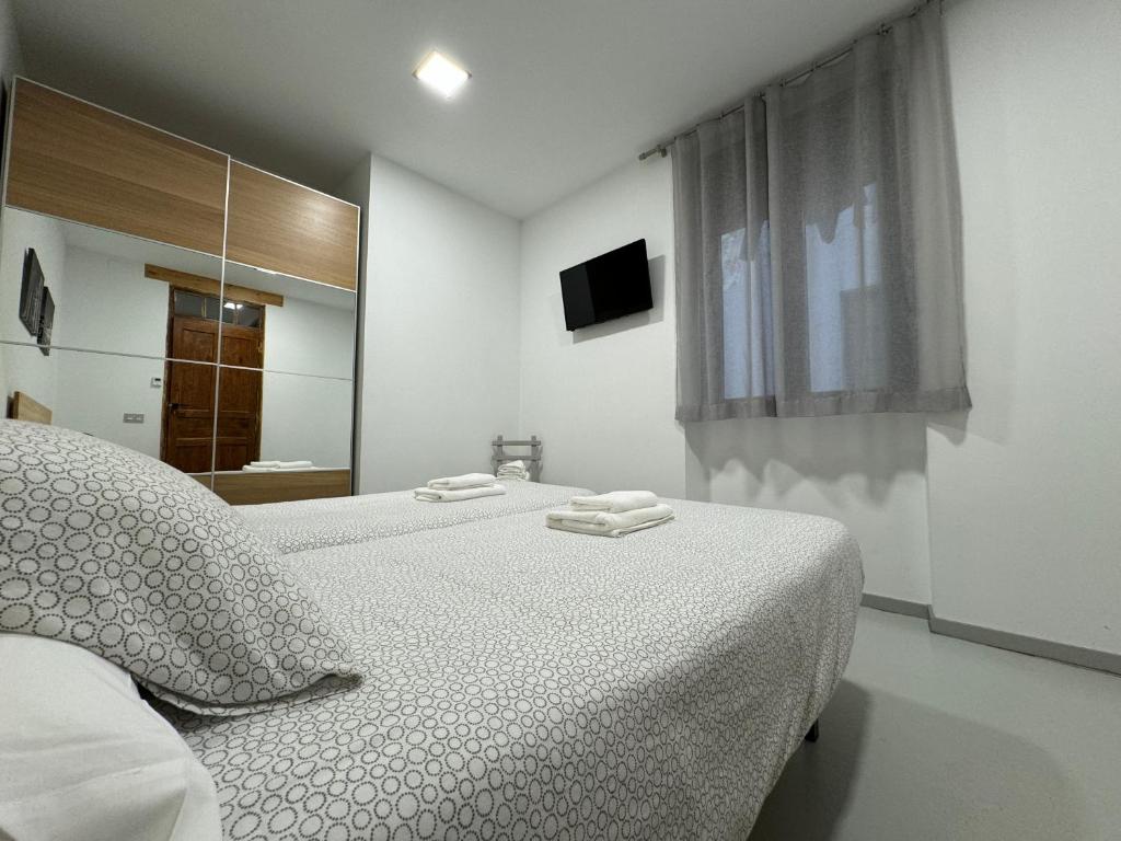 Posteľ alebo postele v izbe v ubytovaní Apartamentos Mk77 León- San Isidoro