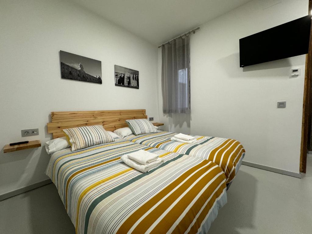 Posteľ alebo postele v izbe v ubytovaní Apartamentos Mk77 León- San Isidoro