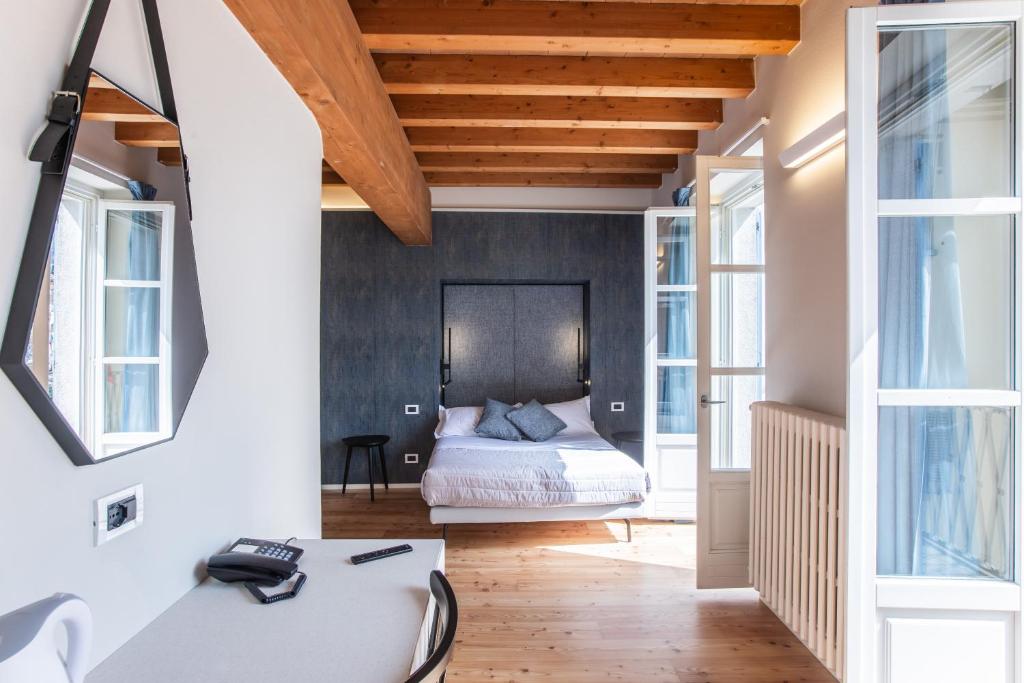 Uma cama ou camas num quarto em Albergo Del Sole