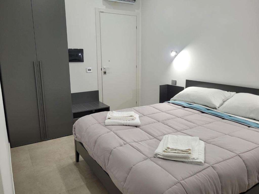 Postel nebo postele na pokoji v ubytování Gemini rooms