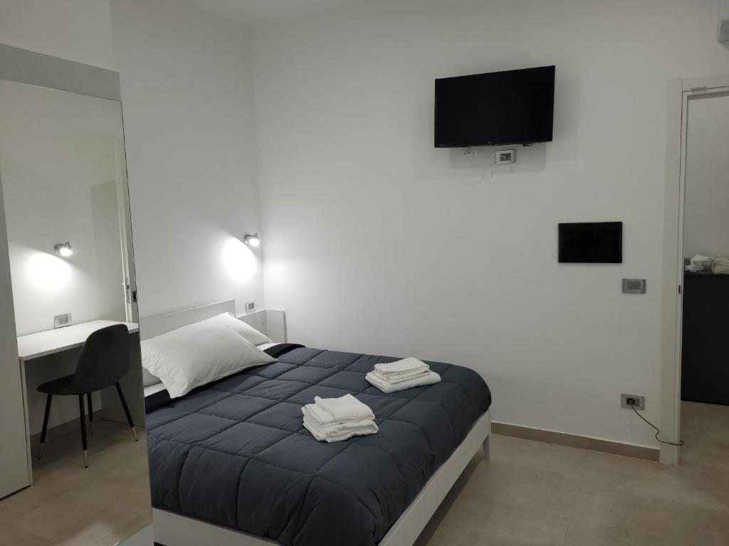 Postel nebo postele na pokoji v ubytování Gemini rooms