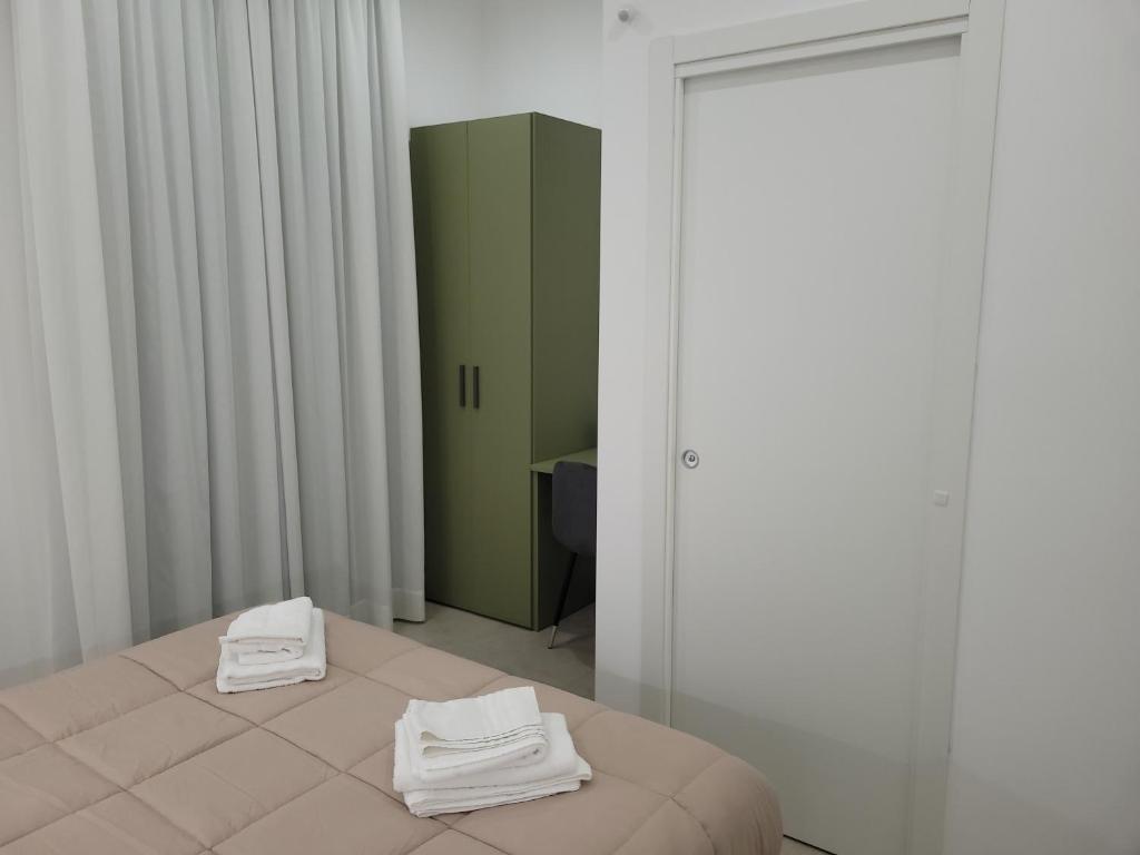 Postel nebo postele na pokoji v ubytování Gemini rooms