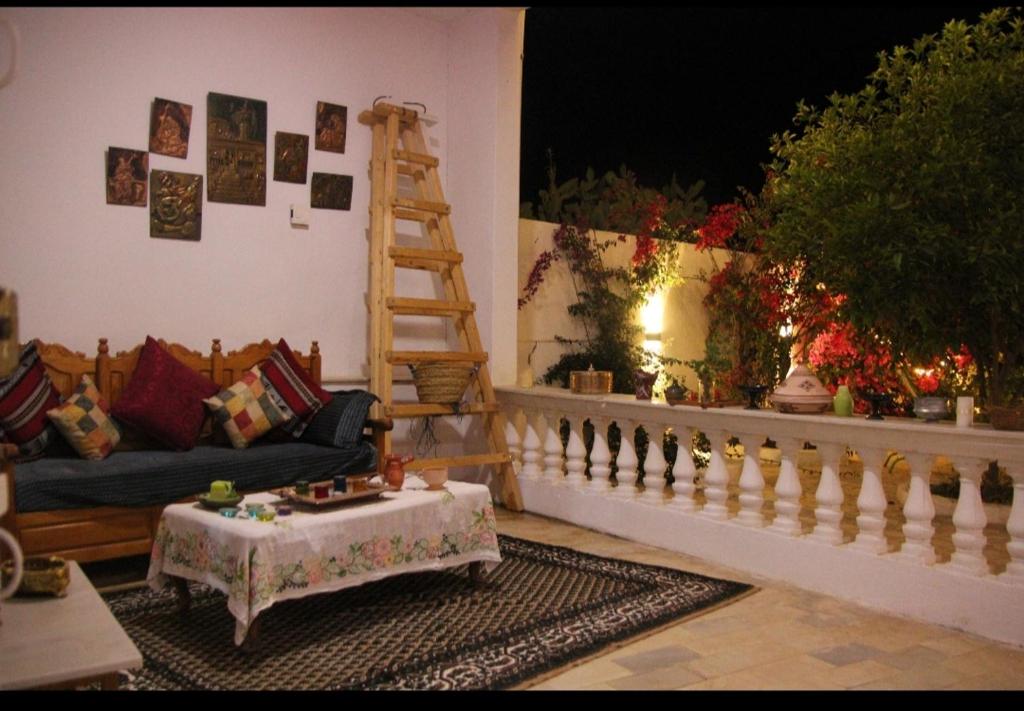 a living room with a couch and a table at Henchir ejdoud in Kairouan