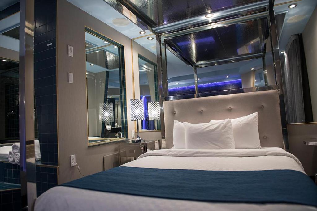 Postel nebo postele na pokoji v ubytování Hôtel Le Rivage