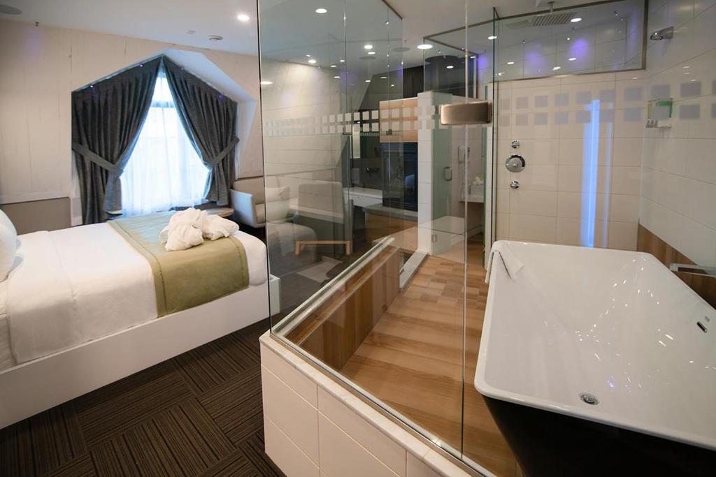 Postel nebo postele na pokoji v ubytování Hôtel Le Rivage