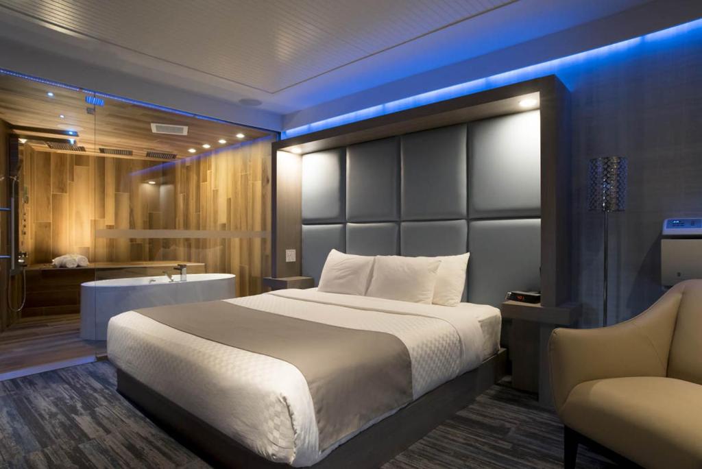 Postel nebo postele na pokoji v ubytování Hôtel Le Rivage