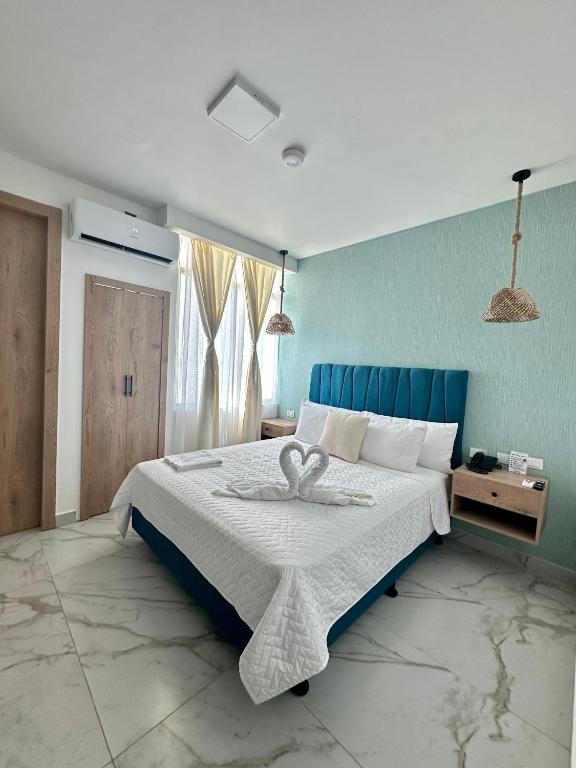 Postel nebo postele na pokoji v ubytování Hotel Presidente Beach Playas