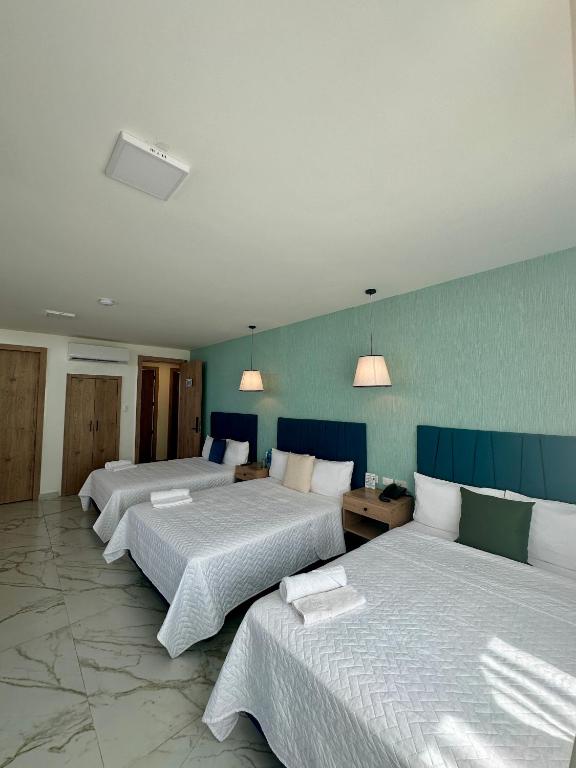 Postel nebo postele na pokoji v ubytování Hotel Presidente Beach Playas