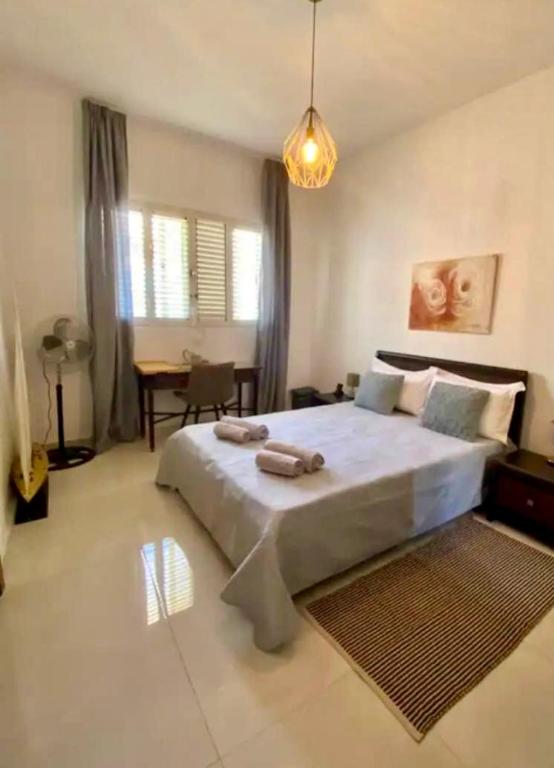 Postel nebo postele na pokoji v ubytování Maltese Garden Villa