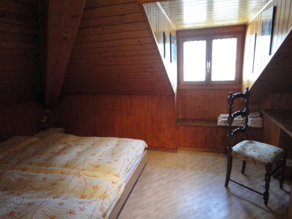 Postel nebo postele na pokoji v ubytování Osteria Anzonico