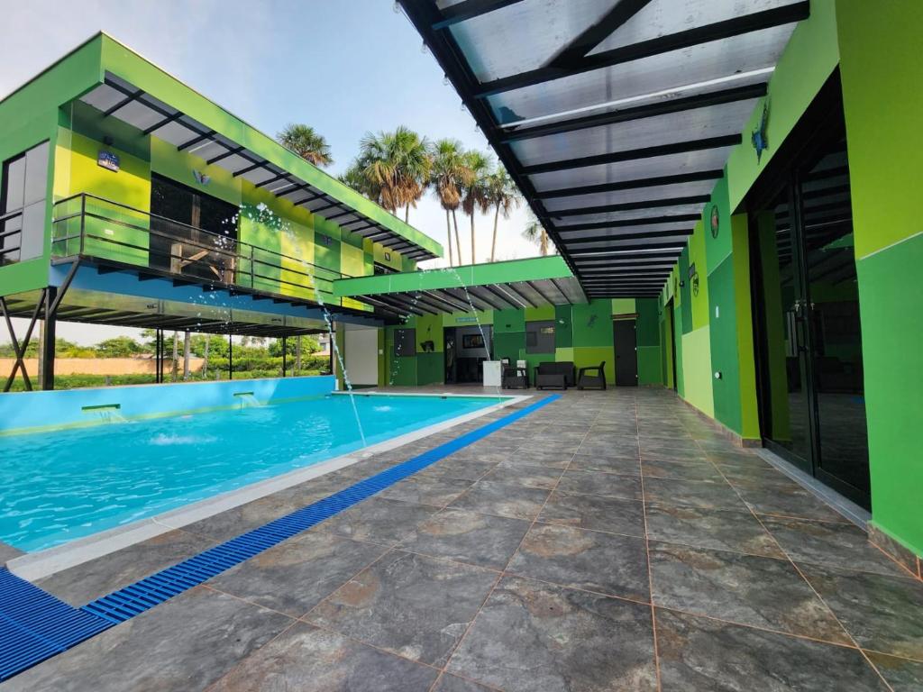 an image of a swimming pool in a house at Encanto Llanero XKPDestinations. in Villavicencio