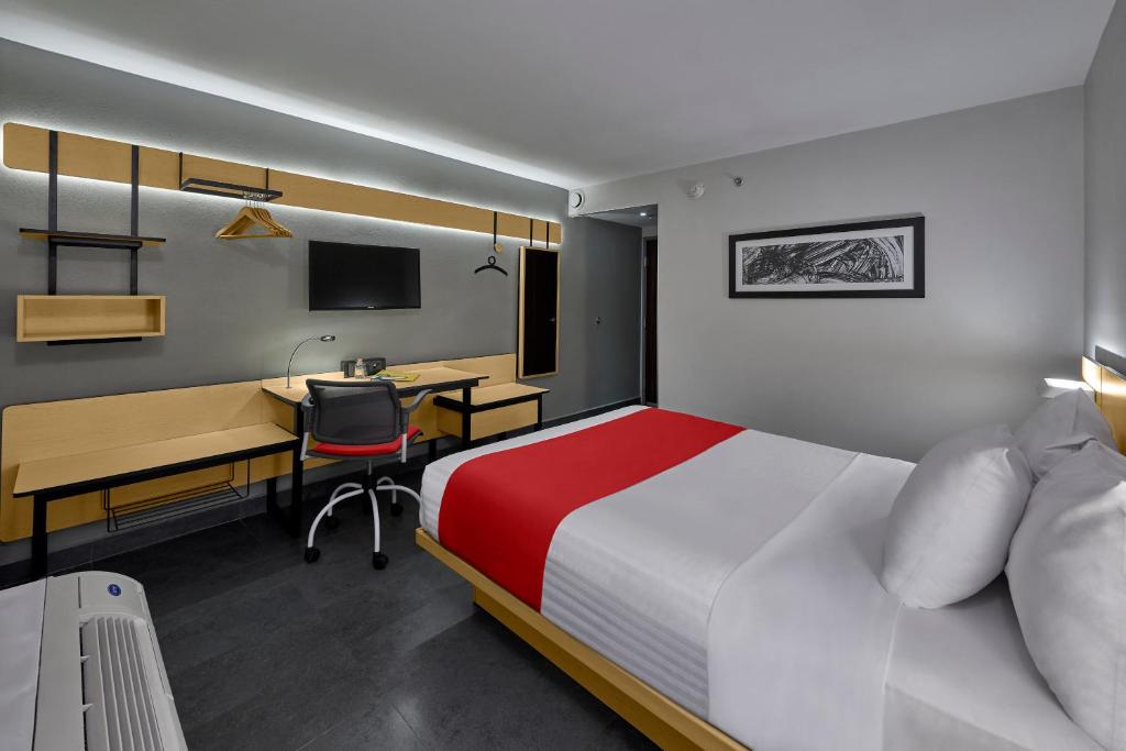 TV a/nebo společenská místnost v ubytování City Express by Marriott Veracruz