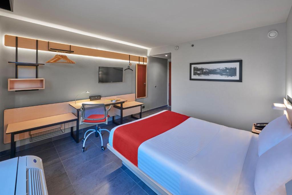Postel nebo postele na pokoji v ubytování City Express by Marriott Veracruz