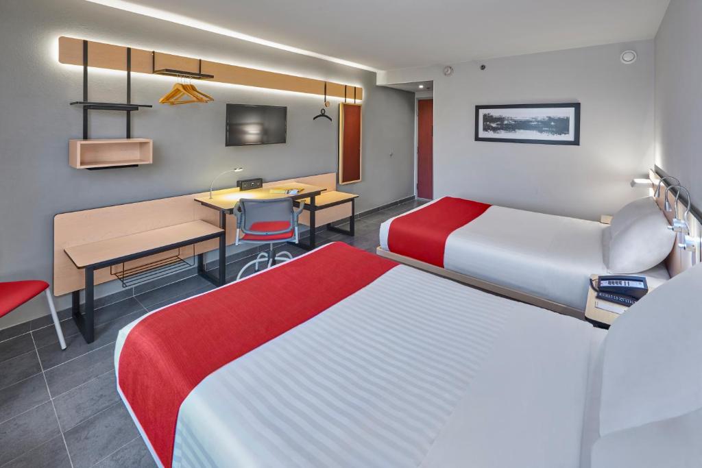 Postel nebo postele na pokoji v ubytování City Express by Marriott Veracruz
