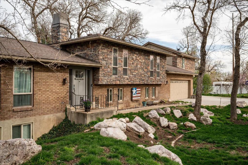 a brick house with rocks in front of it at Summit Sanctuary Mountain Escape in Ogden