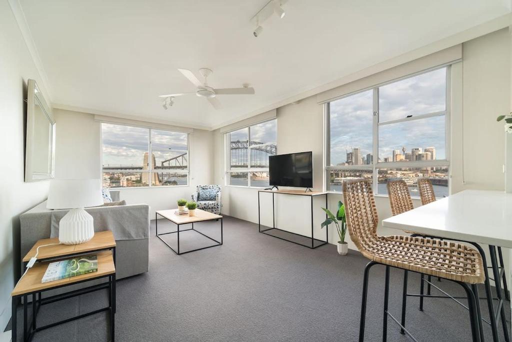 a living room with a view of a city at Harbourside #49 in Sydney
