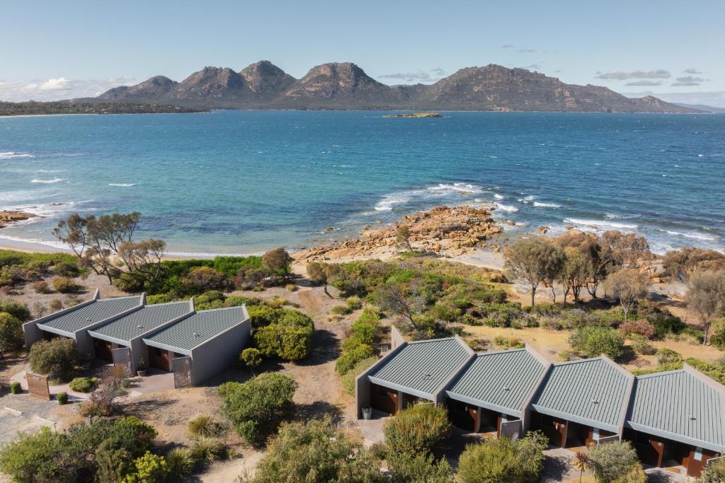 an aerial view of a row of houses by the ocean at Edge of the Bay Resort in Coles Bay