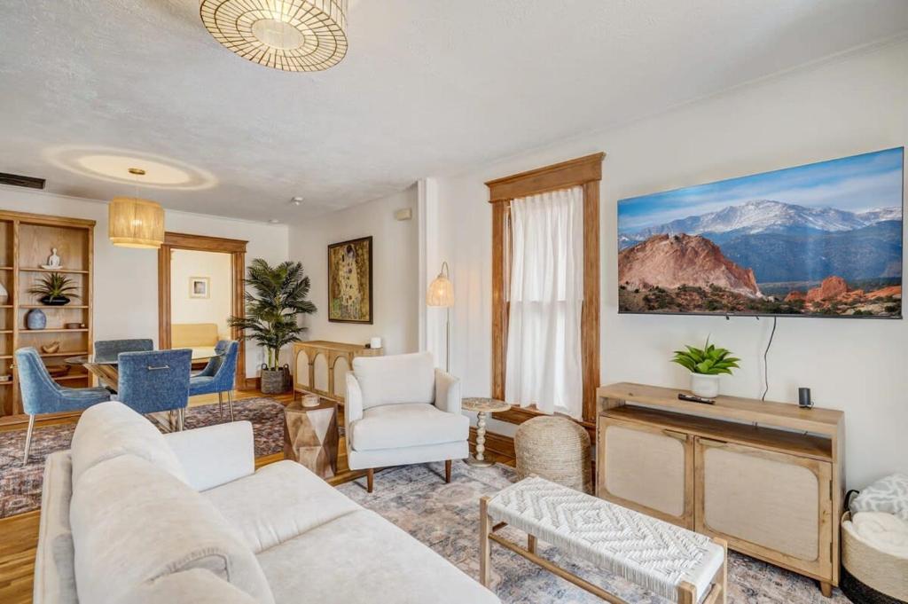 a living room with a couch and a table at Close to All the Action Walk to Garden of the Gods in Colorado Springs