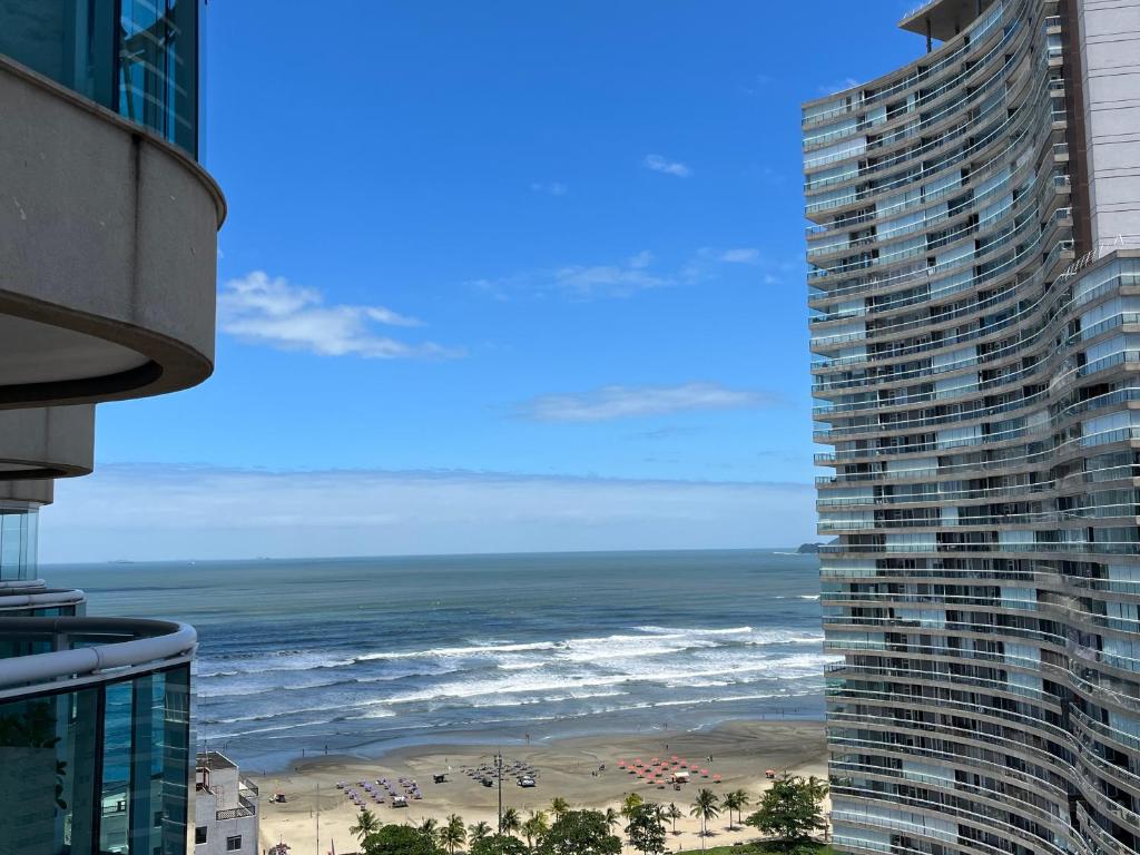 a view of the ocean from a building at Estanconfor Vista Mar em Santos in Santos