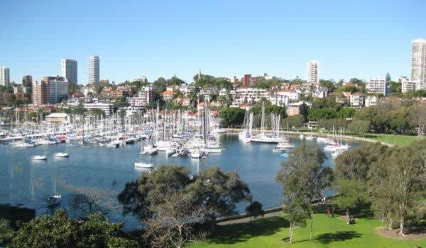 a harbor filled with lots of boats in a city at Darlinghurst Apt W A C Balcony Only A Walk To CBD in Sydney