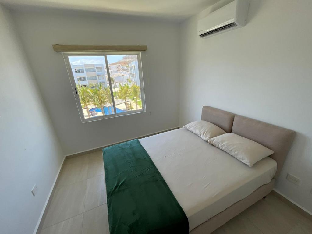 Postel nebo postele na pokoji v ubytování ALMARENA RESIDENCIAL