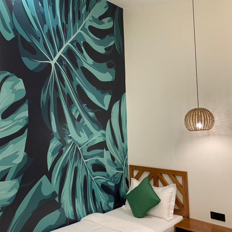 Postel nebo postele na pokoji v ubytování Bahandi Hotel