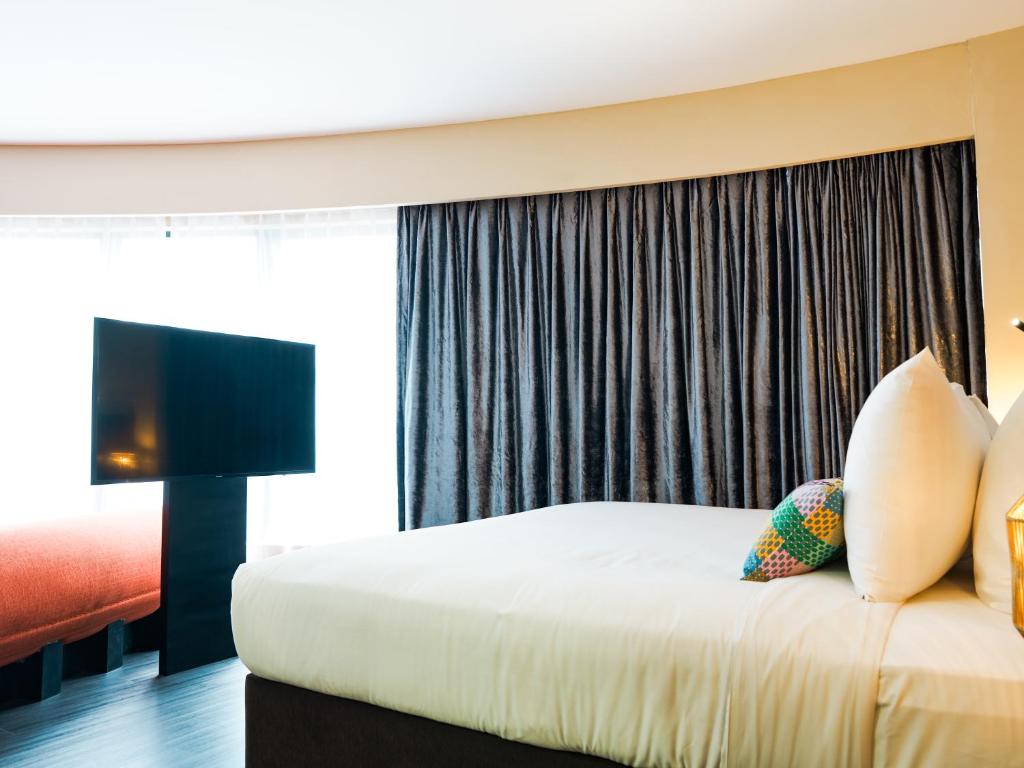 Postel nebo postele na pokoji v ubytování Starus Hotel Bukit Bintang