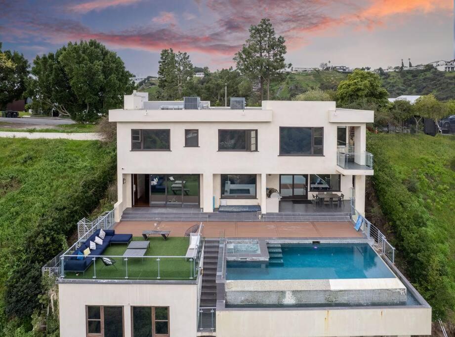 an aerial view of a house with a swimming pool at Spectacular Views: Exquisite Villa, Pool, Jacuzzi! in Los Angeles