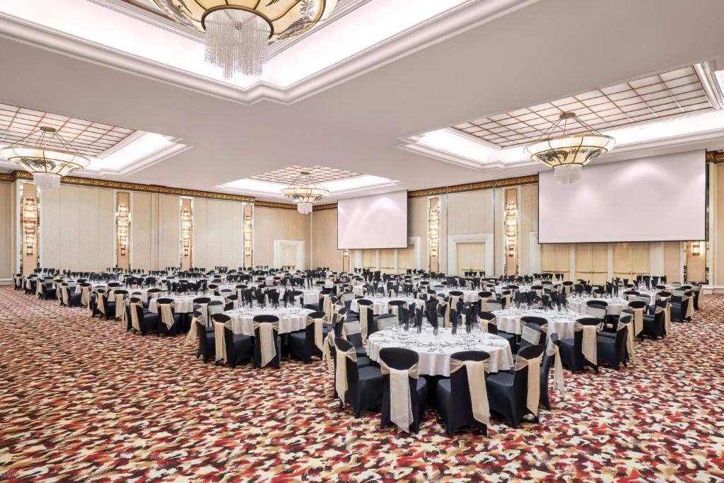 a large banquet hall with tables and chairs at InterContinental Grand Ho Tram in Ho Tram