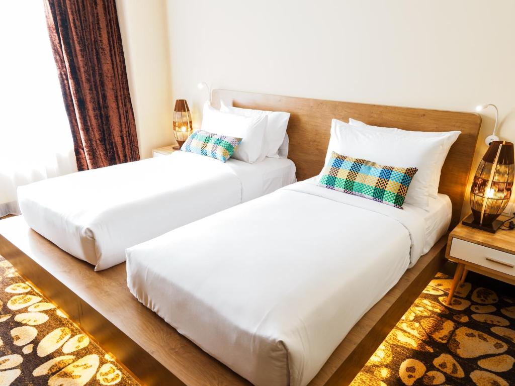 Postel nebo postele na pokoji v ubytování Starus Hotel Bukit Bintang
