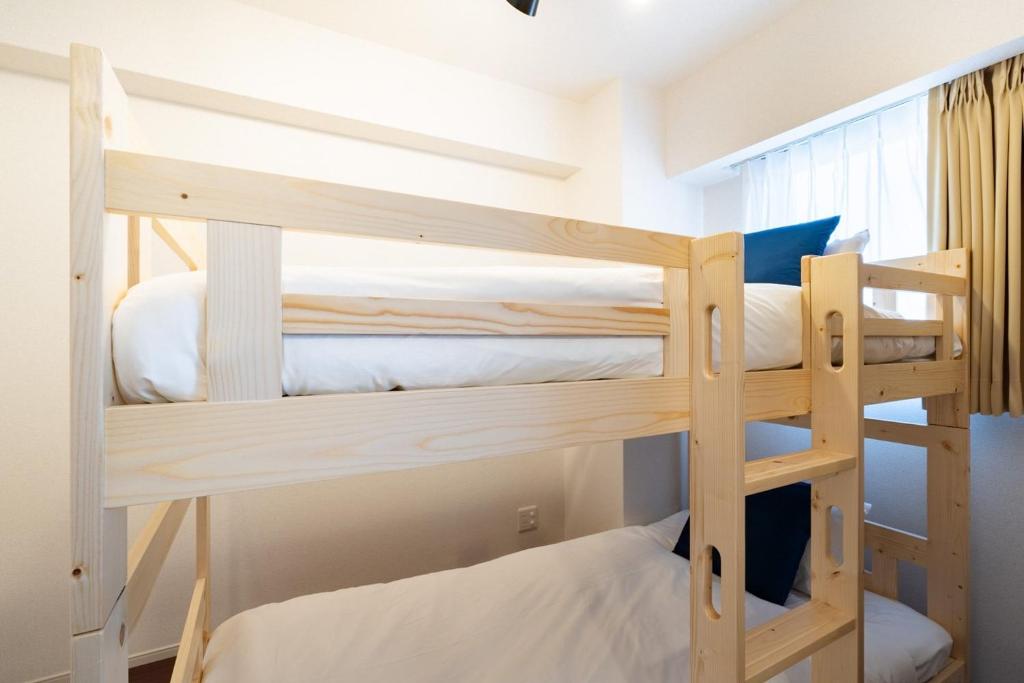 Postel nebo postele na pokoji v ubytování Art Nagara