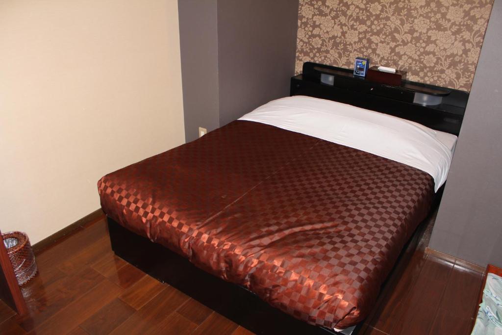 Postel nebo postele na pokoji v ubytování Hotel Shiosai