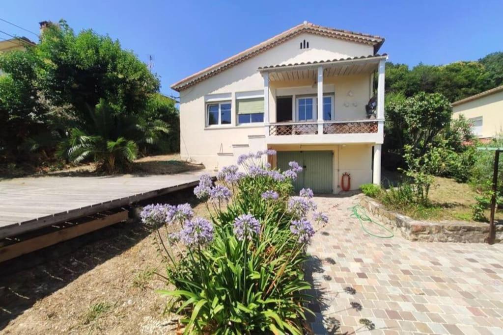 a house with a walkway in front of it at Charming, quiet house 7 minutes walk from center in Antibes