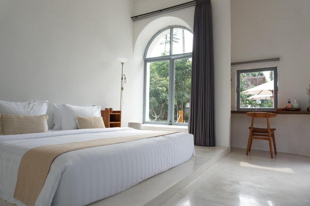 Postel nebo postele na pokoji v ubytování LAYANA FARMSTAY