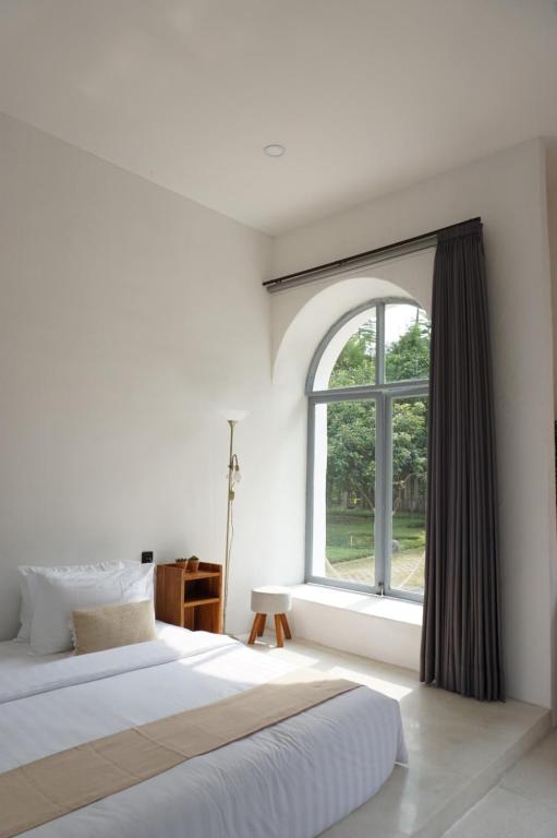 Postel nebo postele na pokoji v ubytování LAYANA FARMSTAY