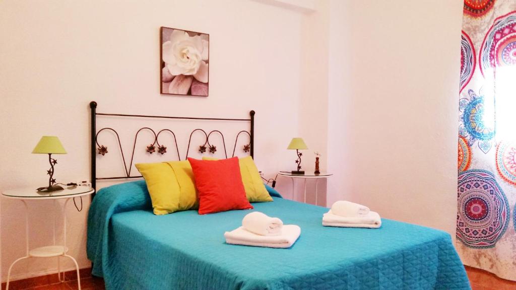Łóżko lub łóżka w pokoju w obiekcie Apartamento Jose Maria Corona