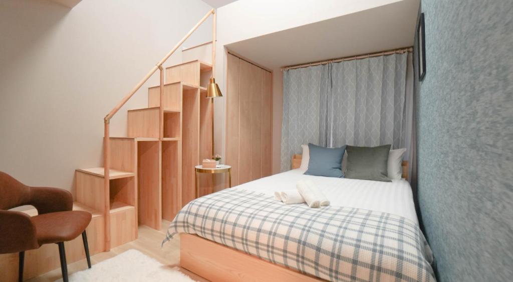 En eller flere senge i et værelse på 和御 汐美・沐美