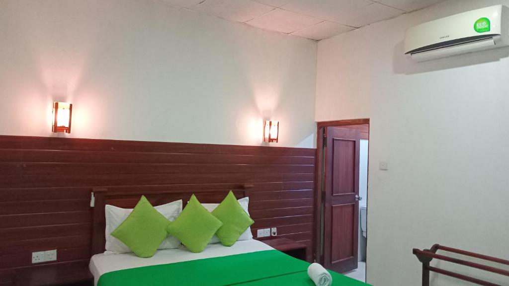 Postel nebo postele na pokoji v ubytování Habarana Dulwan Guest House