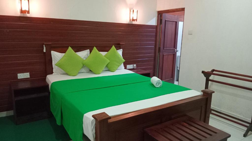 Postel nebo postele na pokoji v ubytování Habarana Dulwan Guest House